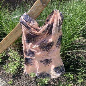 Beautiful blouse with feather details.